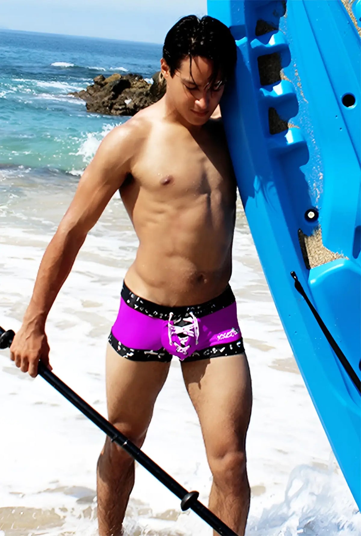 Icker sea lace up contrast square cut swim trunks in vibrant purple with black trim and a white skull design