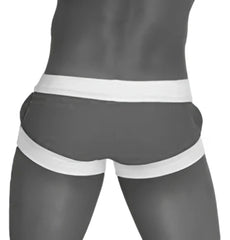 Icker Sea legs blue square cut trunk swimwear with snug black and white striped briefs design in front view