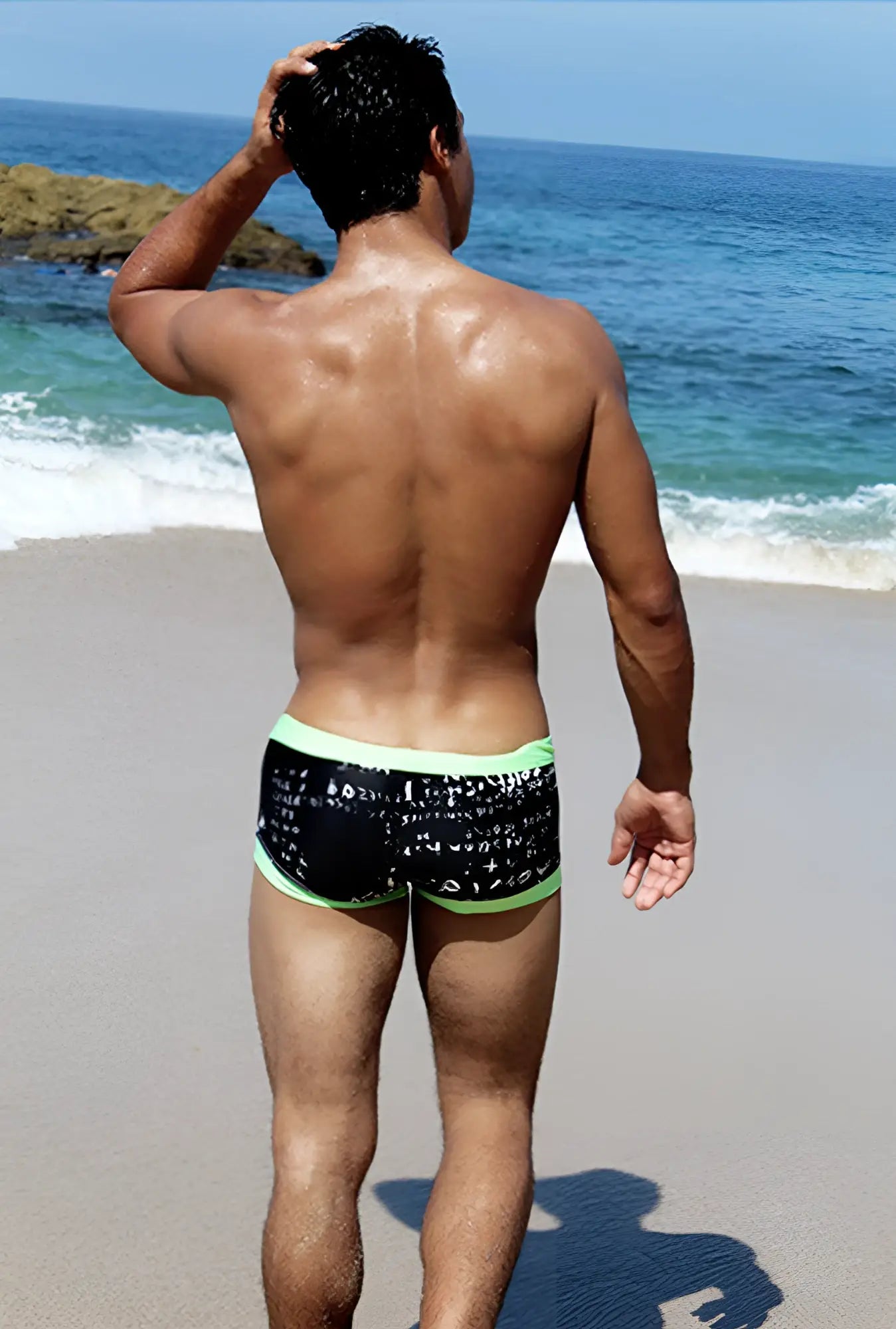 Icker Sea Letters square cut black swim trunks with white math equation pattern and bright green trim