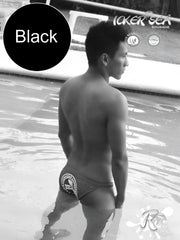 Black icker sea lifeguard micro slip bikini swimwear backside showing white logo on black swim trunks