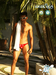 Red swim trunks with white drawstrings and red cross emblem in icker sea lifeguard micro slip bikini swimwear red cob 13 10
