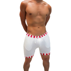 White athletic shorts with red and white candy stripe trim waistband and hem featuring a drawstring closure by icker sea