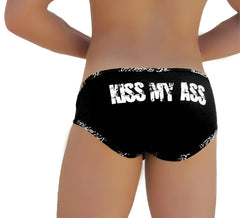Black icker sea briefs with white distressed kiss my ass text across the back for edgy casual wear