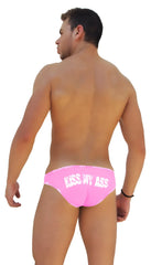 Back side of bright pink Icker Sea logo trim slip bikini underwear featuring white kiss my ass text across the back