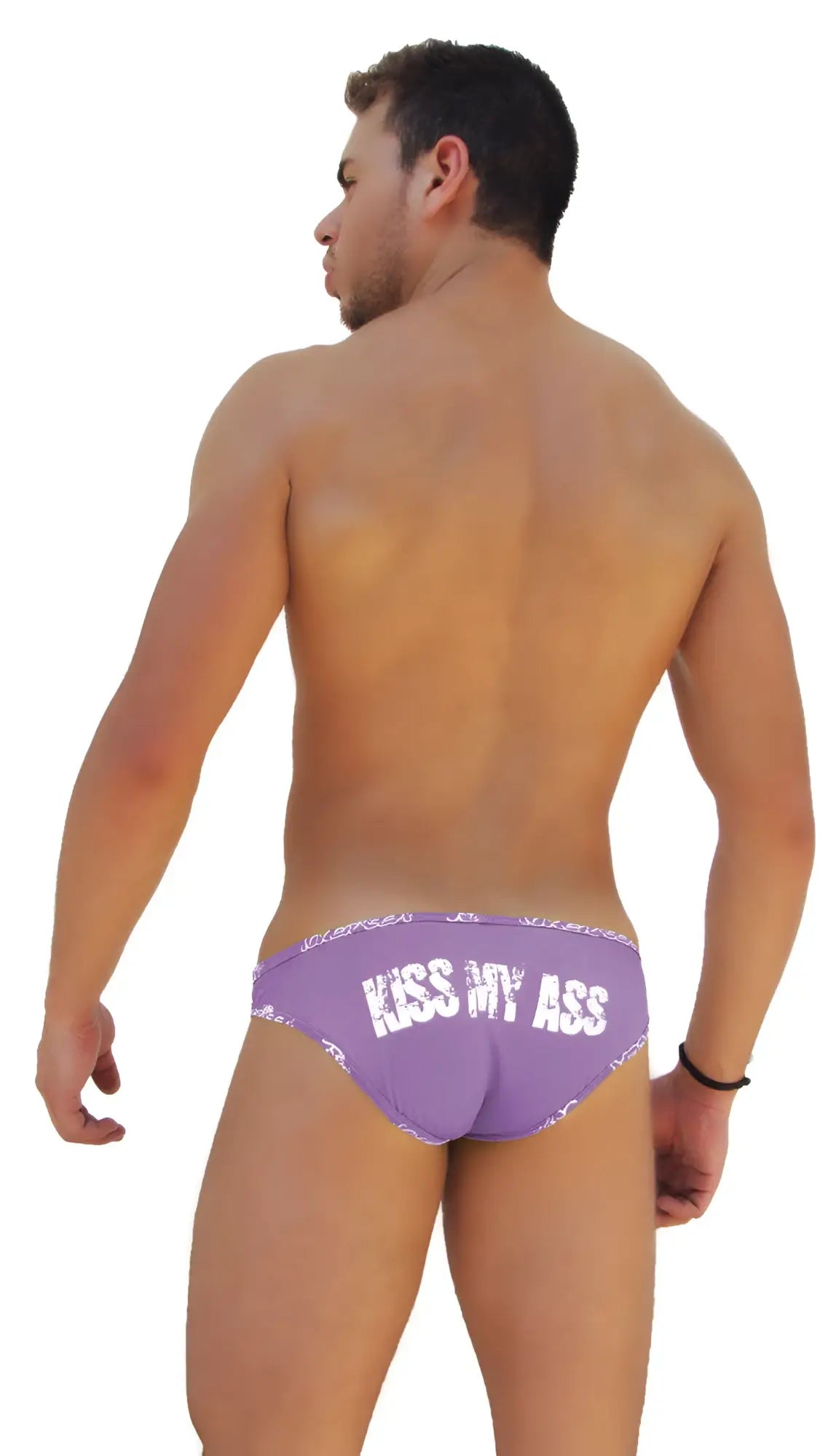 Back side of purple icker sea slip bikini underwear with white lace trim and kiss my ass text across the back