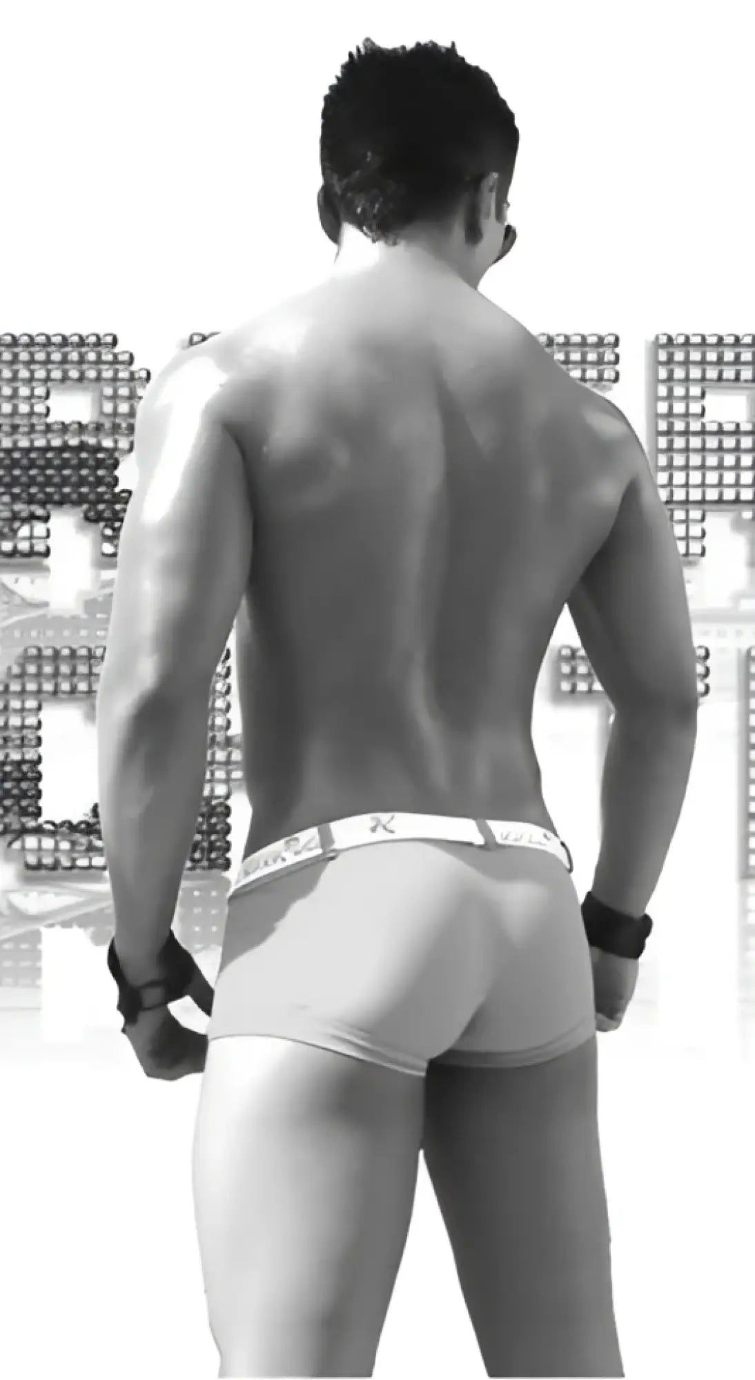 Black and white image of a muscular man wearing Icker Sea sailor belted logo square cut trunk swimwear in red and white