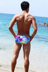 Vibrant tie-dye swim trunks in blue pink and yellow from icker sea spring bikini swimwear white cob 15 20 collection