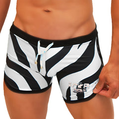 Icker Sea zebra open side suspender scalloped swim trunks with black waistband zebra stripes and light blue drawstrings