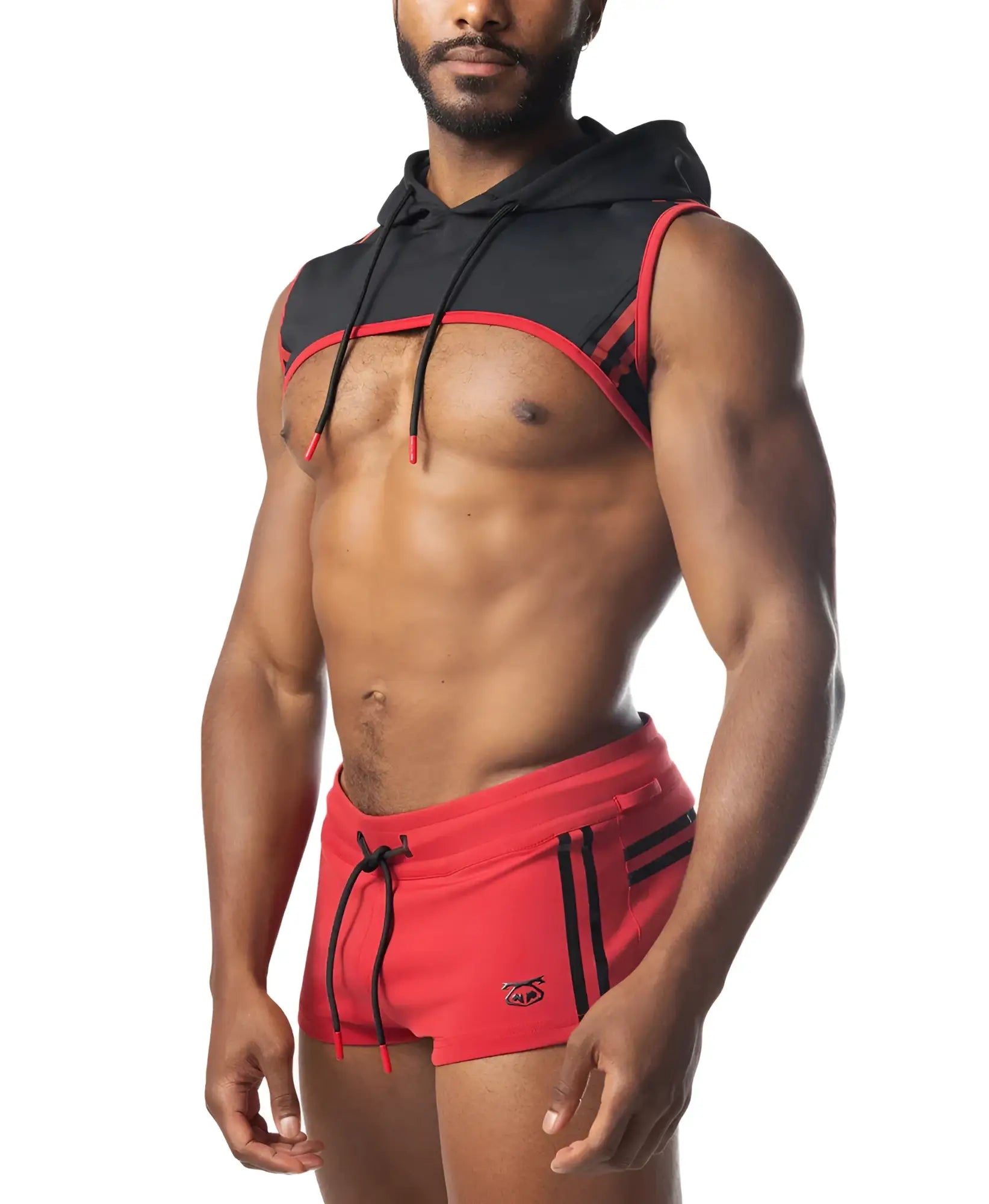 Black and red sleeveless ignite cropped hoodie with drawstring hood worn over a muscular torso