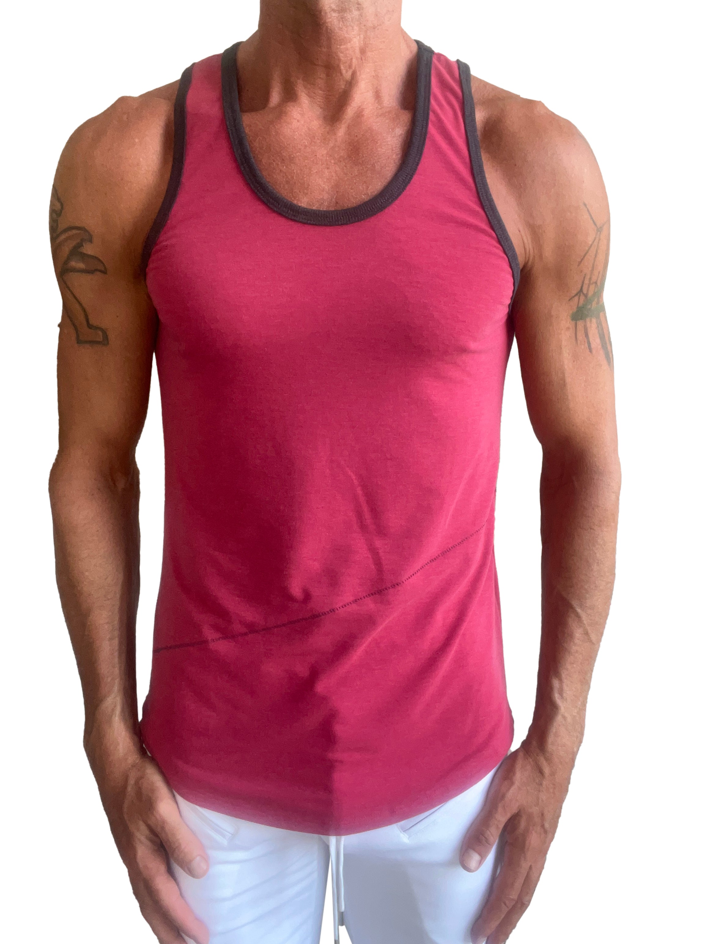 A men’s red tank top called the perfect tank raspberry with black trim around the neckline and armholes