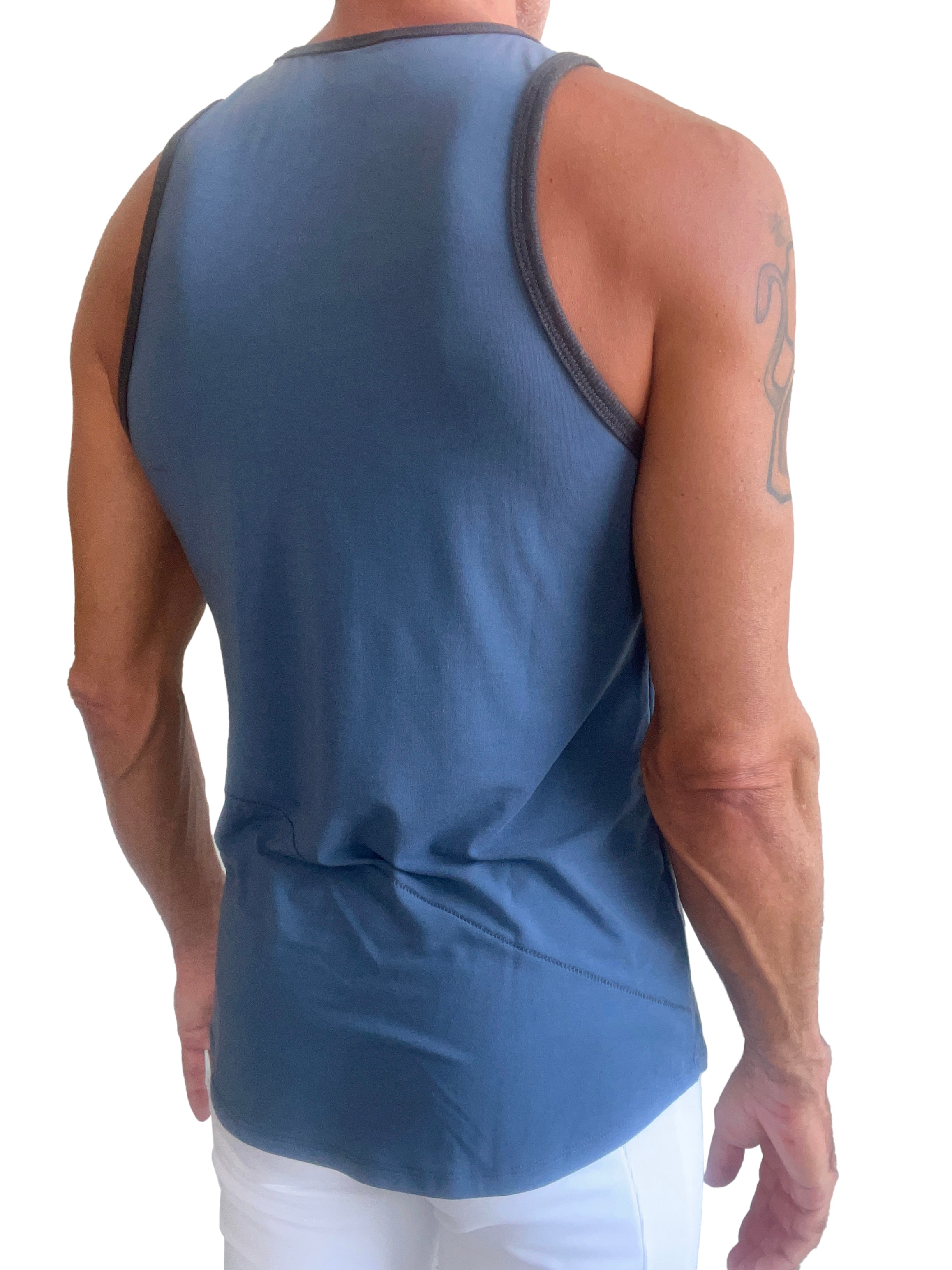 Blue athletic tank top called the perfect tank denim blue with dark gray trim along neckline and armholes
