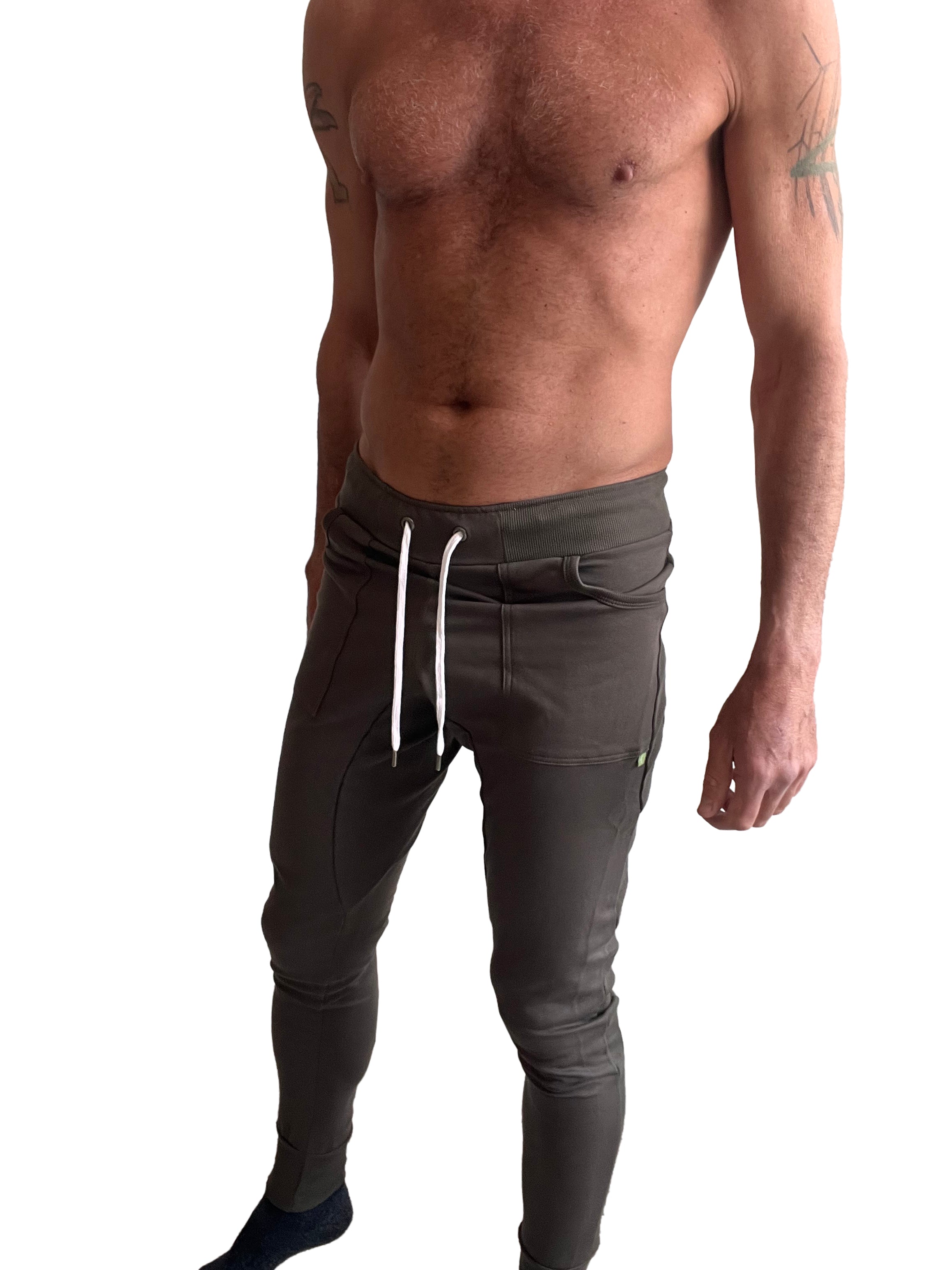Dark olive green long cuffed jogger and yoga sweat pants with white drawstrings sleek form-fitting design