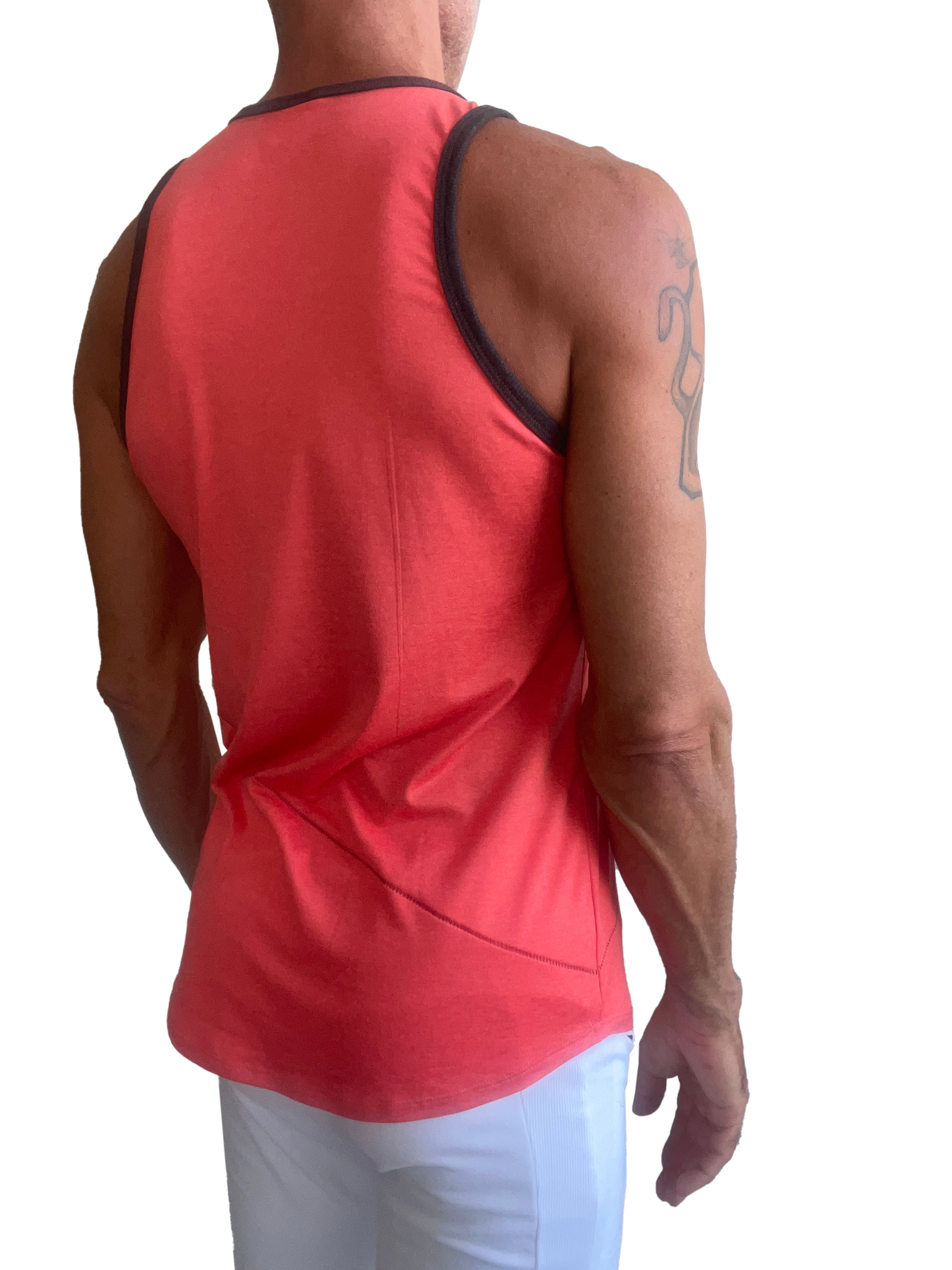 A vibrant coral sleeveless tank top with black trim along the neckline and armholes from the perfect tank coral line