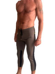 Mens 4/5 zipper pocket capri yoga pants in olive green with black side panels and drawstring waistband for athletic use