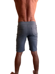 Back view of dark heather grey performance premium urban tactical dress shorts with elastic waistband and two rear pockets