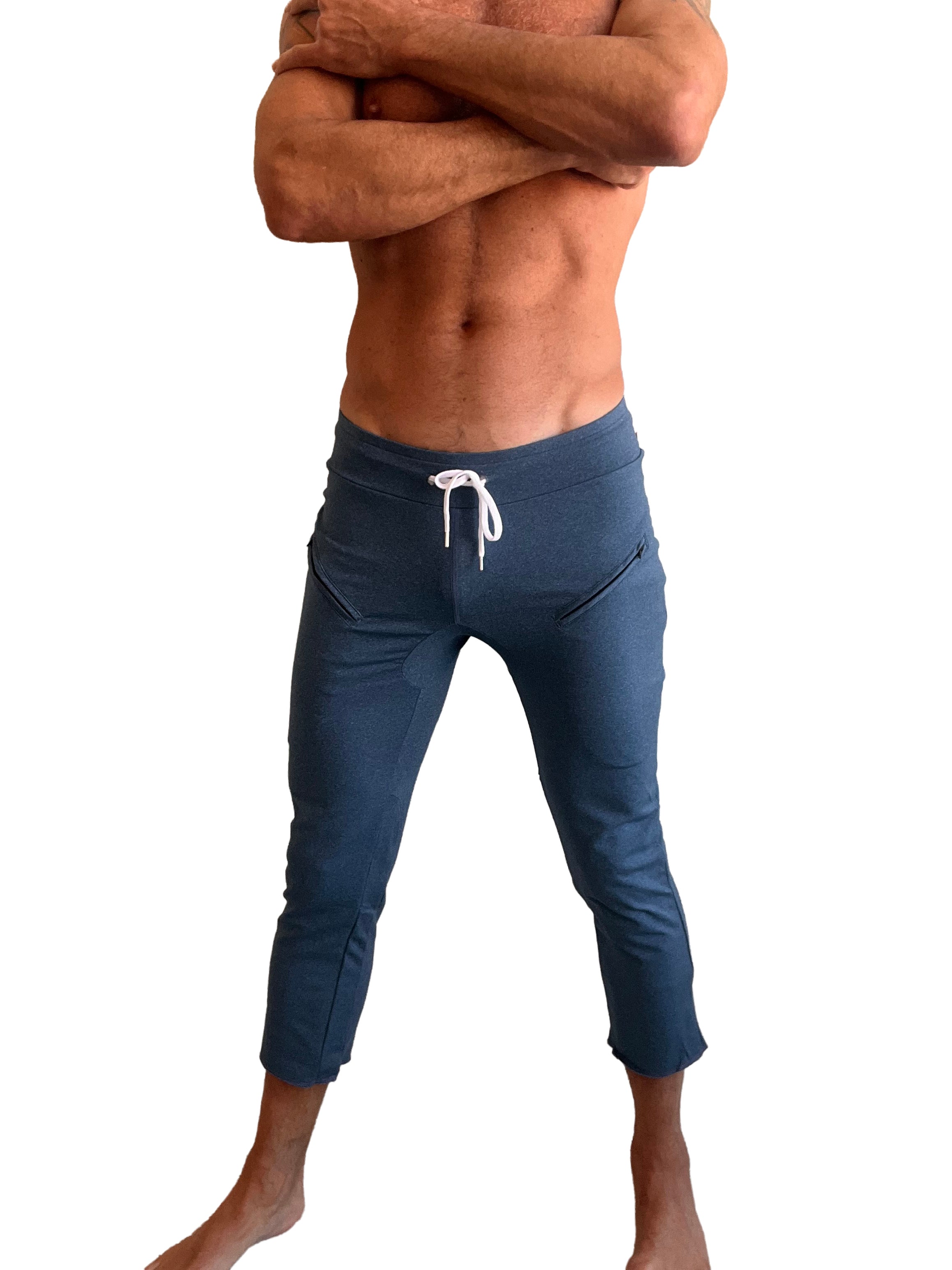 Dark blue athletic capri yoga pants with white drawstring waistband and side pockets for men performance premium