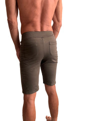 Back view of olive green urban tactical at home dress shorts with ribbed waistband and two back pockets
