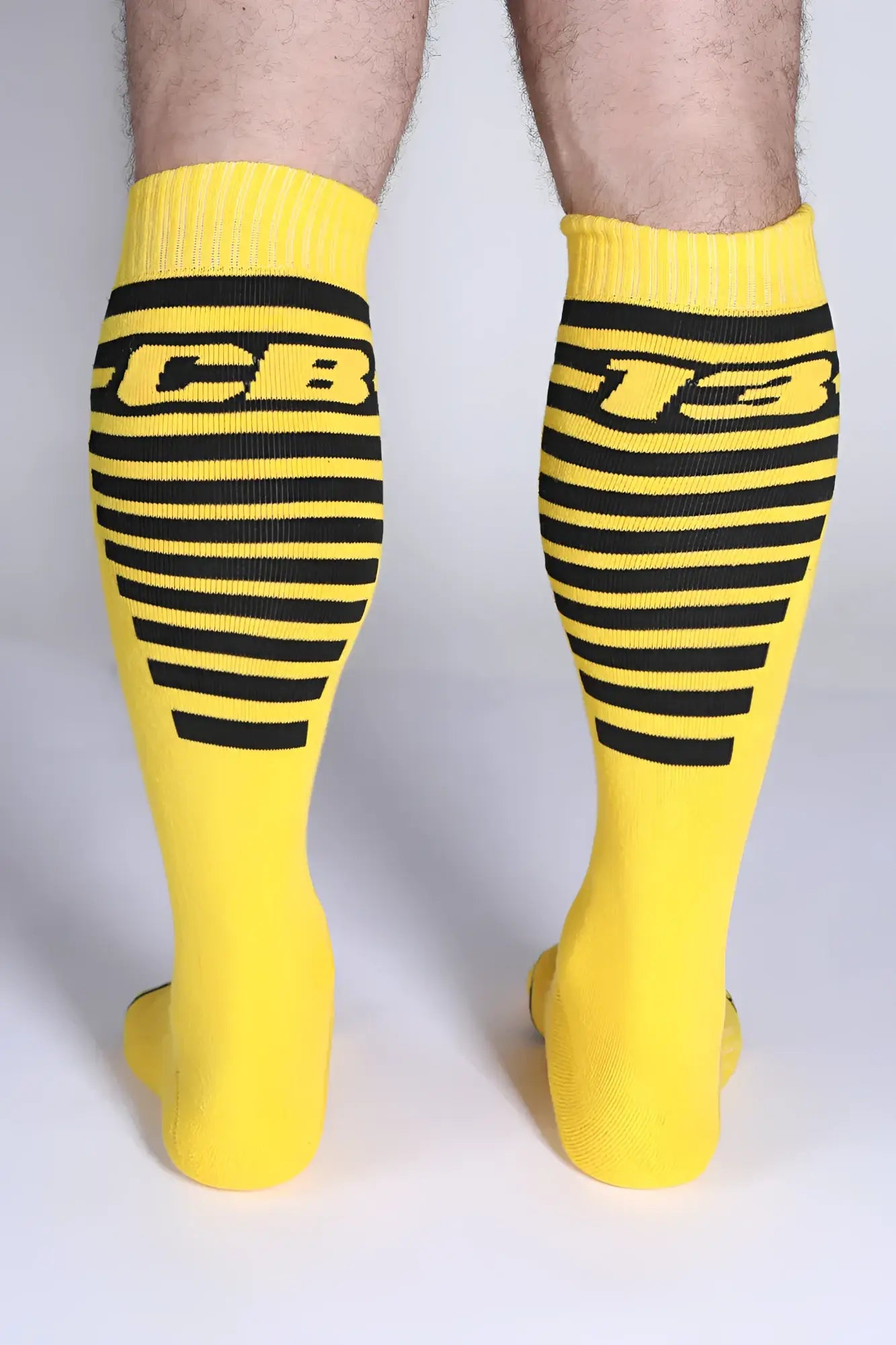 Iron grip knee high socks bright yellow with bold black stripes and cb-13 logo for sporty style and grip