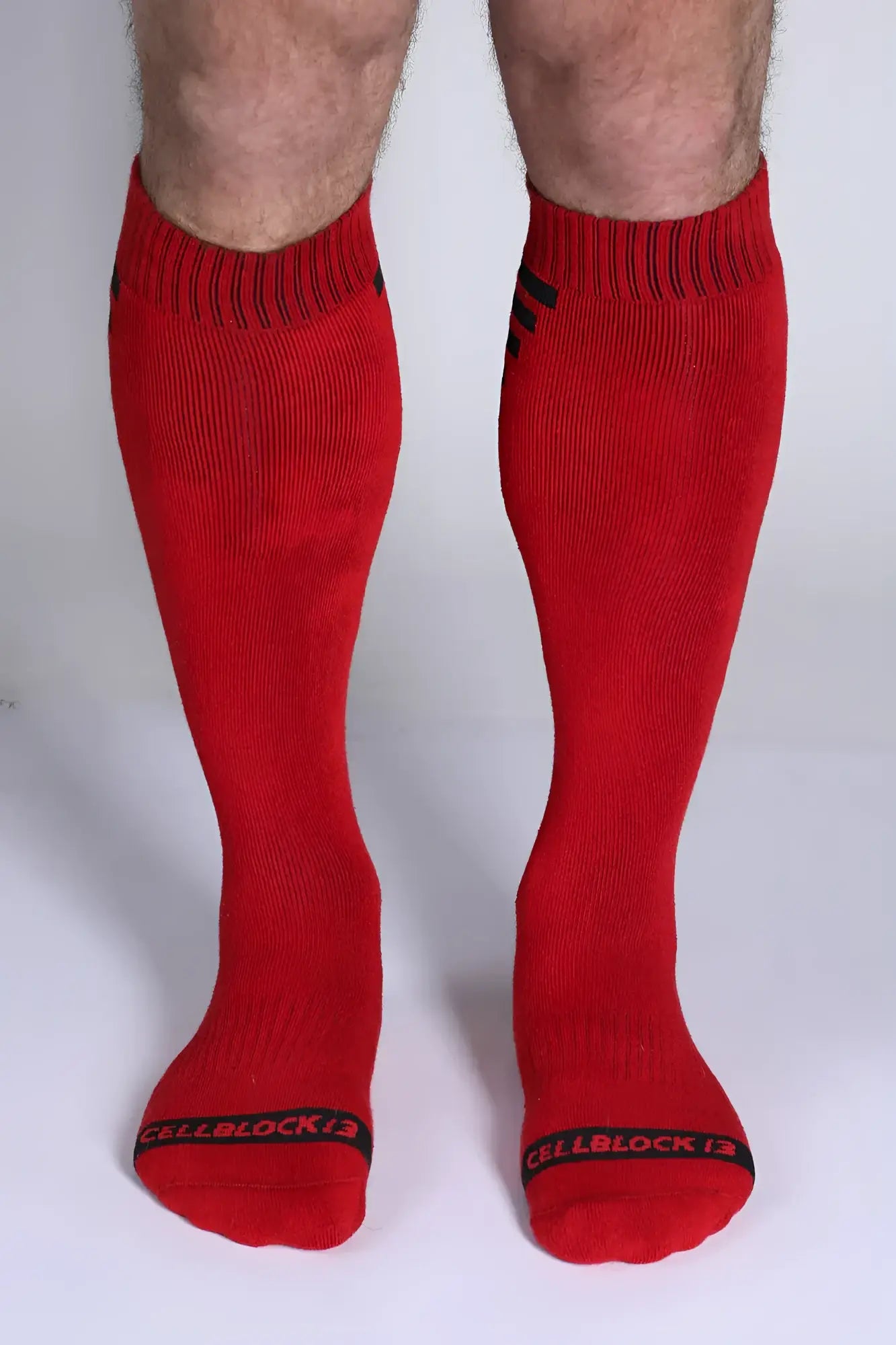 Iron grip knee high socks in red with black ribbed cuffs and toe bands featuring cellblock 13 logo