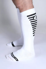 Iron grip knee high socks white athletic knee-high socks with black diagonal stripes and tiblock 13 branding near toe