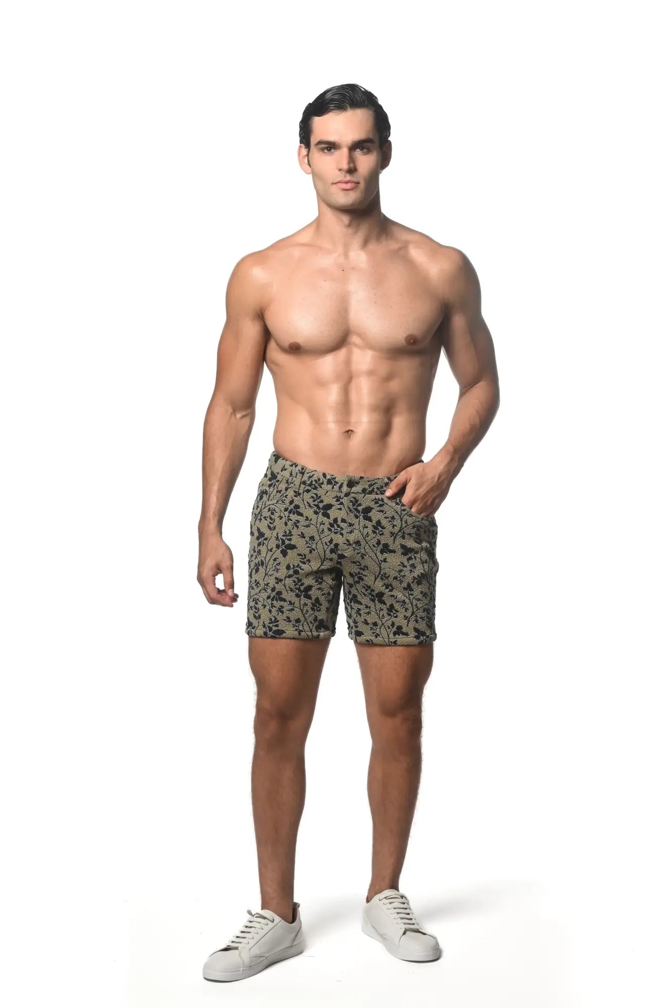 Men’s jacquard printed stretch knit shorts in olive green with a black floral pattern front view