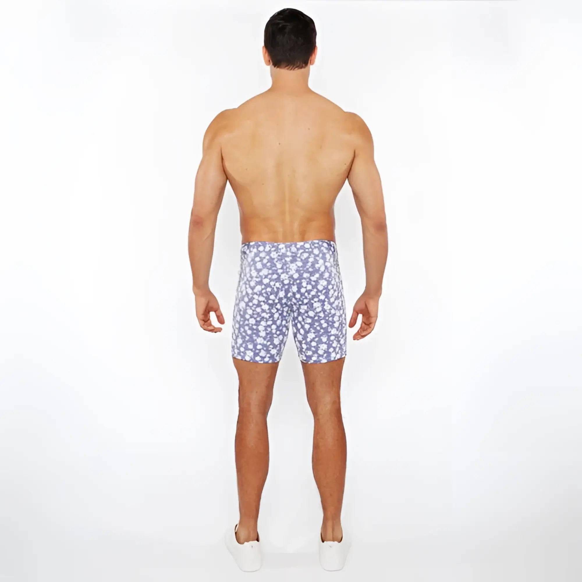 Blue and white floral patterned jacquard stretch knit shorts ideal for swimwear and casual use