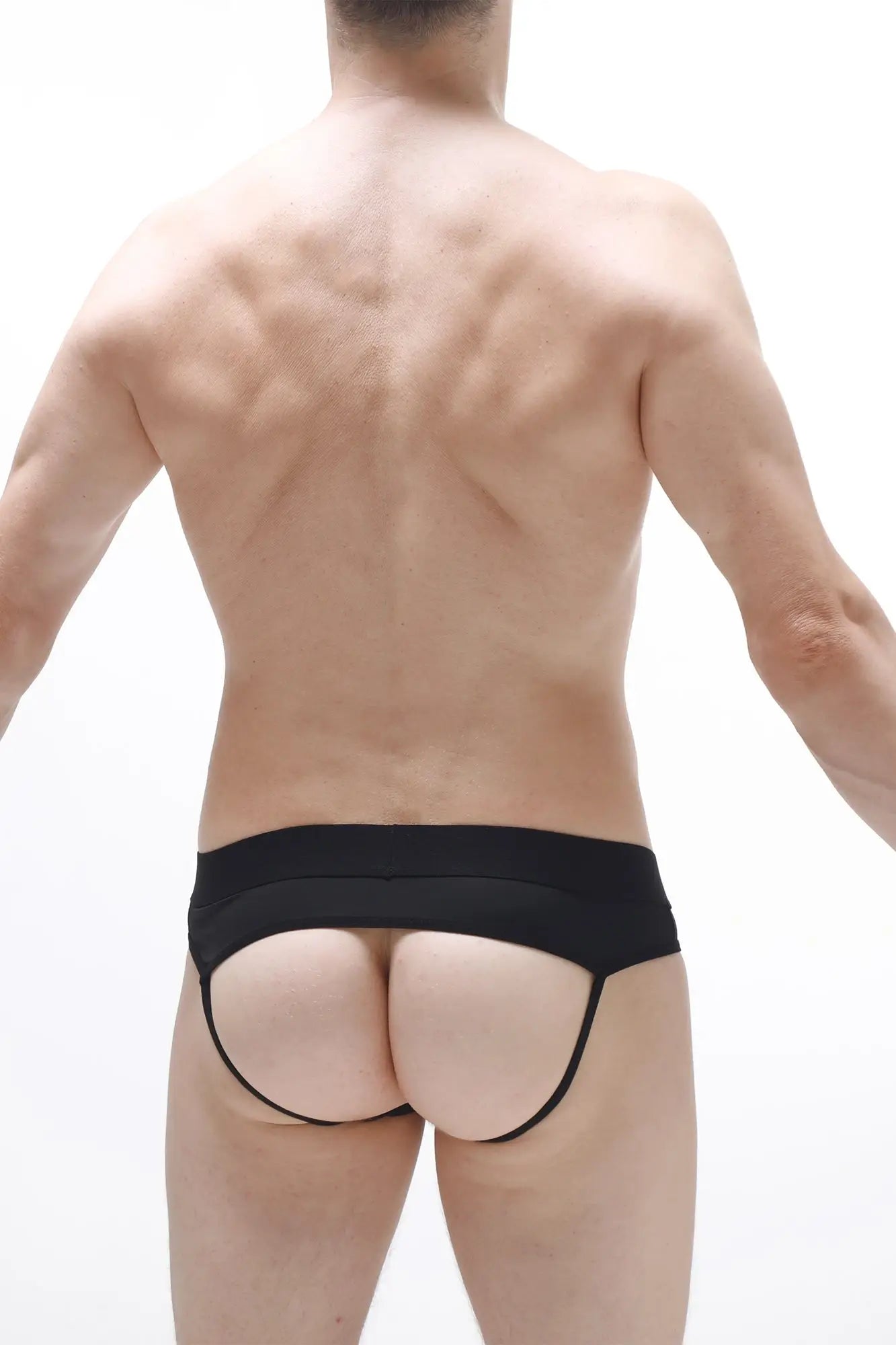 Black form-fitting jockstrap open traist with wide waistband and thin side straps showing the back side