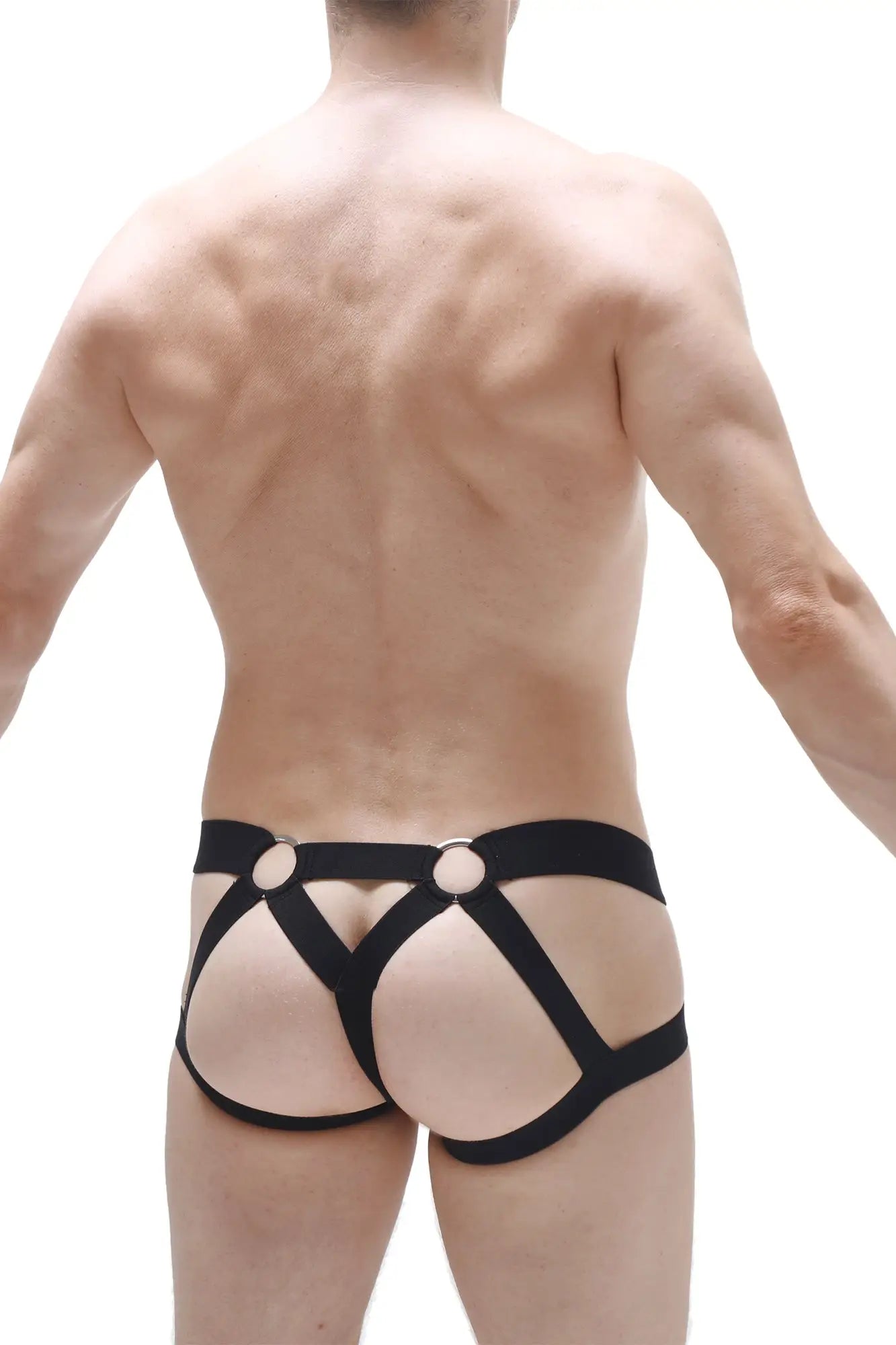 Back view of black leather-like harness-style jockstring brest red briefs with circular metal rings