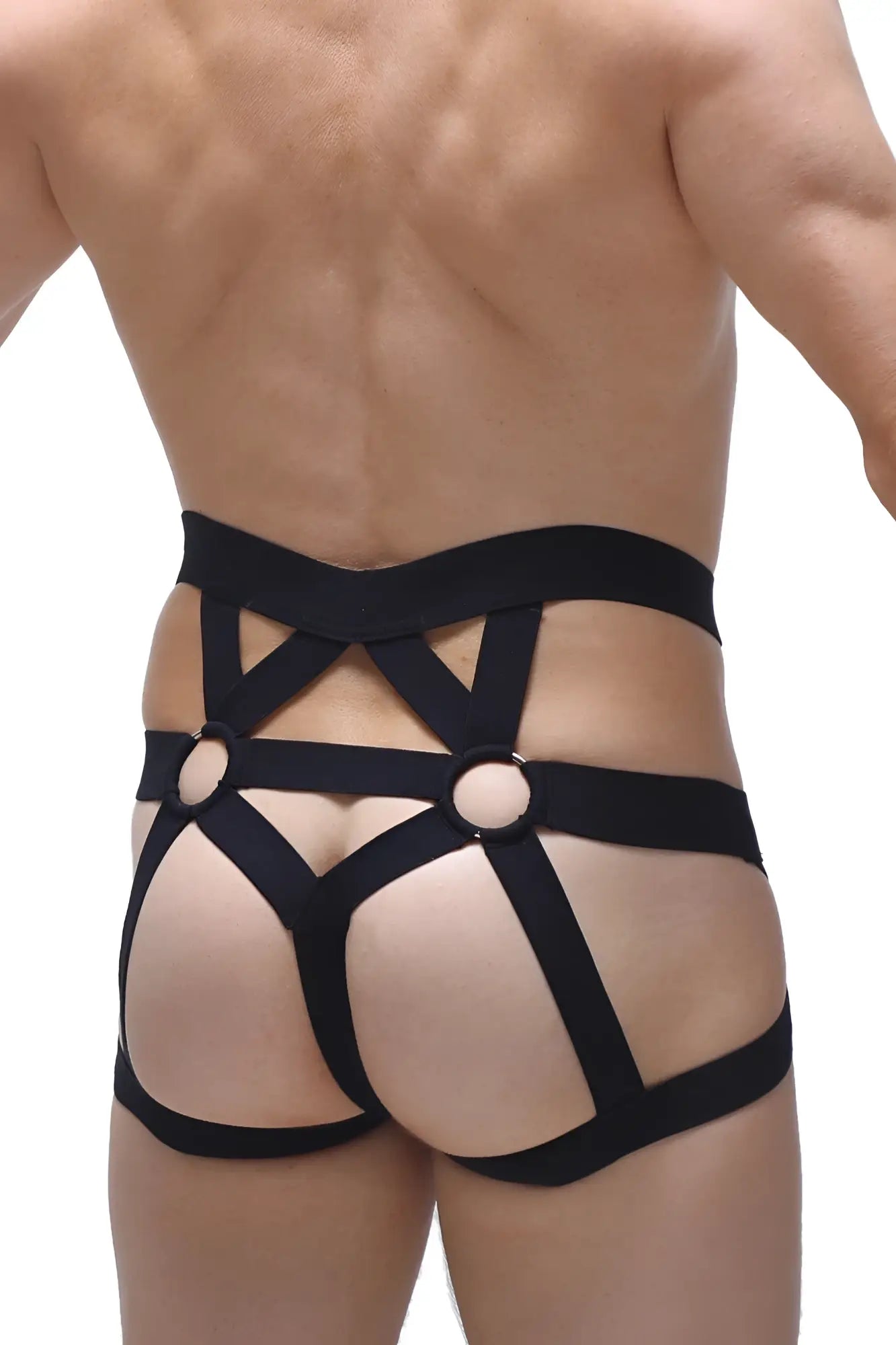 Black elasticated jockstring bustic with crisscross straps and circular metal rings harness design