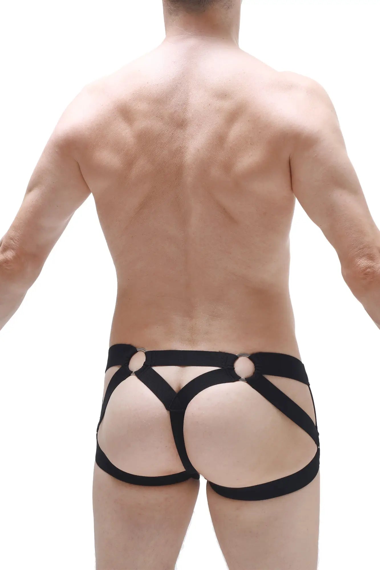 Black harness-style jockstring bustic briefs with bold straps and circular metal accents for edgy fashion