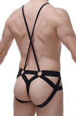 Black strappy harness-style jockstring suspenbust briefs with crisscross back straps and metal rings shown from back