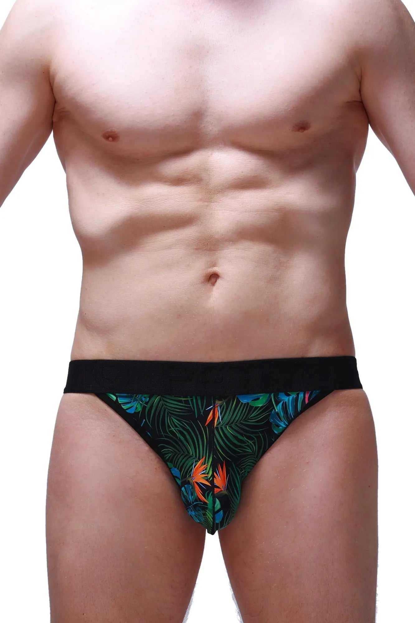 Black jockstring tropical briefs featuring a vibrant tropical leaf and bird pattern in green blue and orange colors