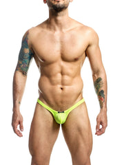 Bright neon green mesh joe snyder bulge thong holes showing back with small black brand tag