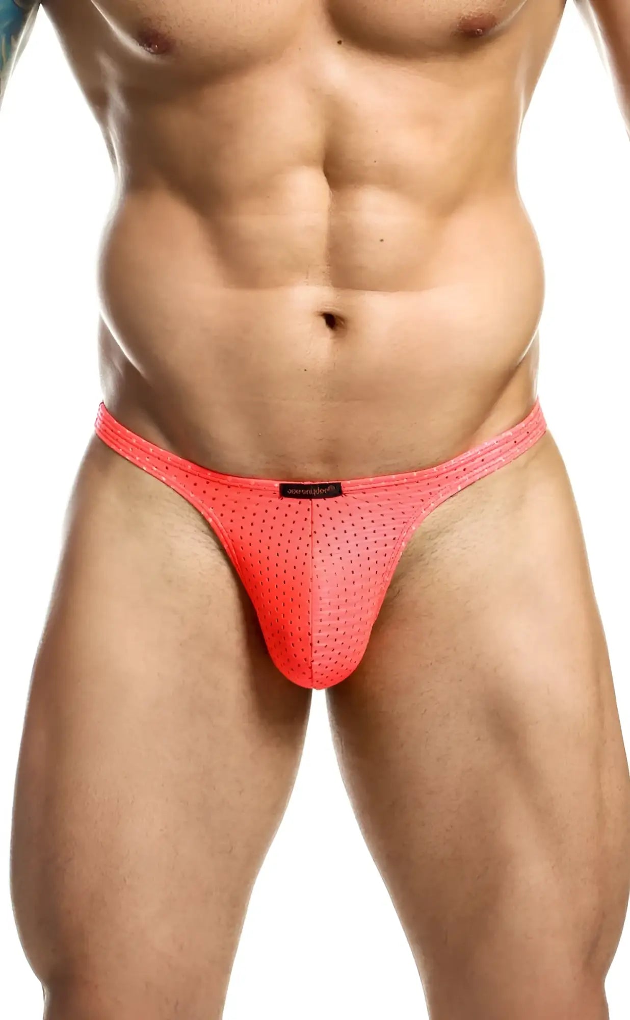 Joe Snyder Holes Thong bright coral pink mesh briefs with subtle perforated texture and black brand tag at waistband