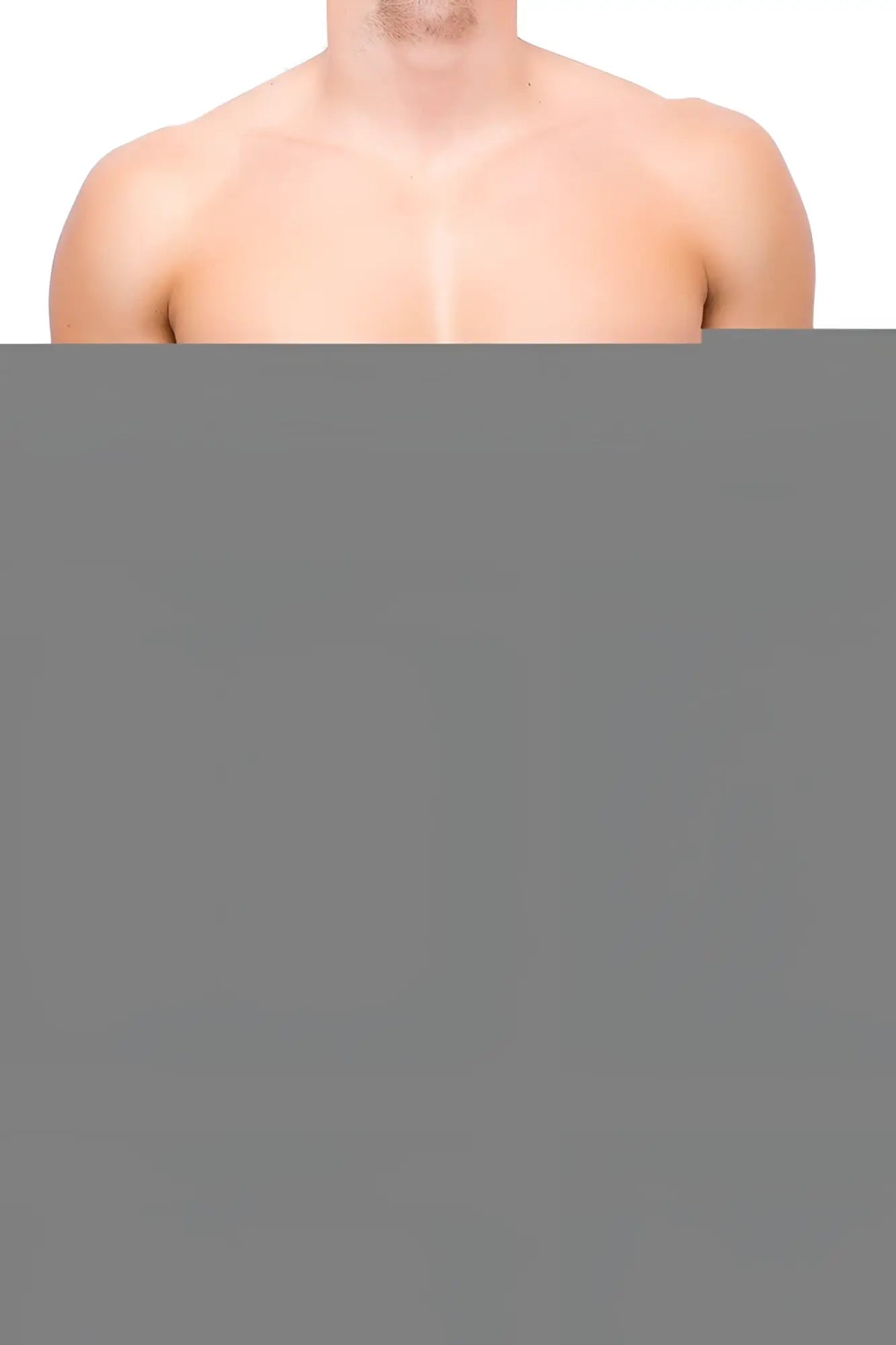 A man showing his bare muscular upper torso wearing joe snyder mini cheek underwear in black against white background