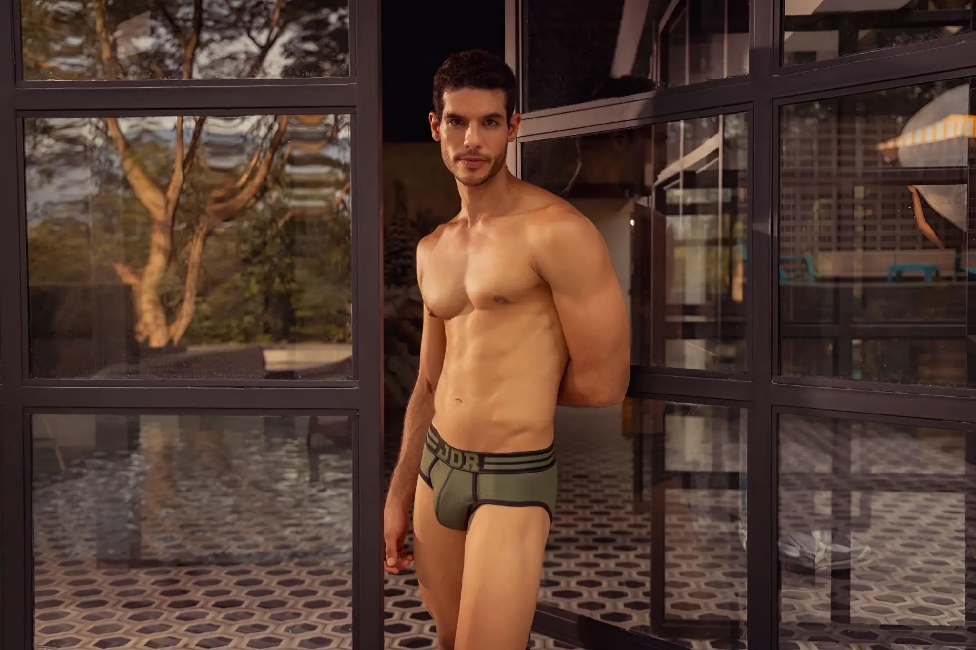 Olive green JOR 1944 college briefs with black elastic waistband and white dor logo on cotton fabric