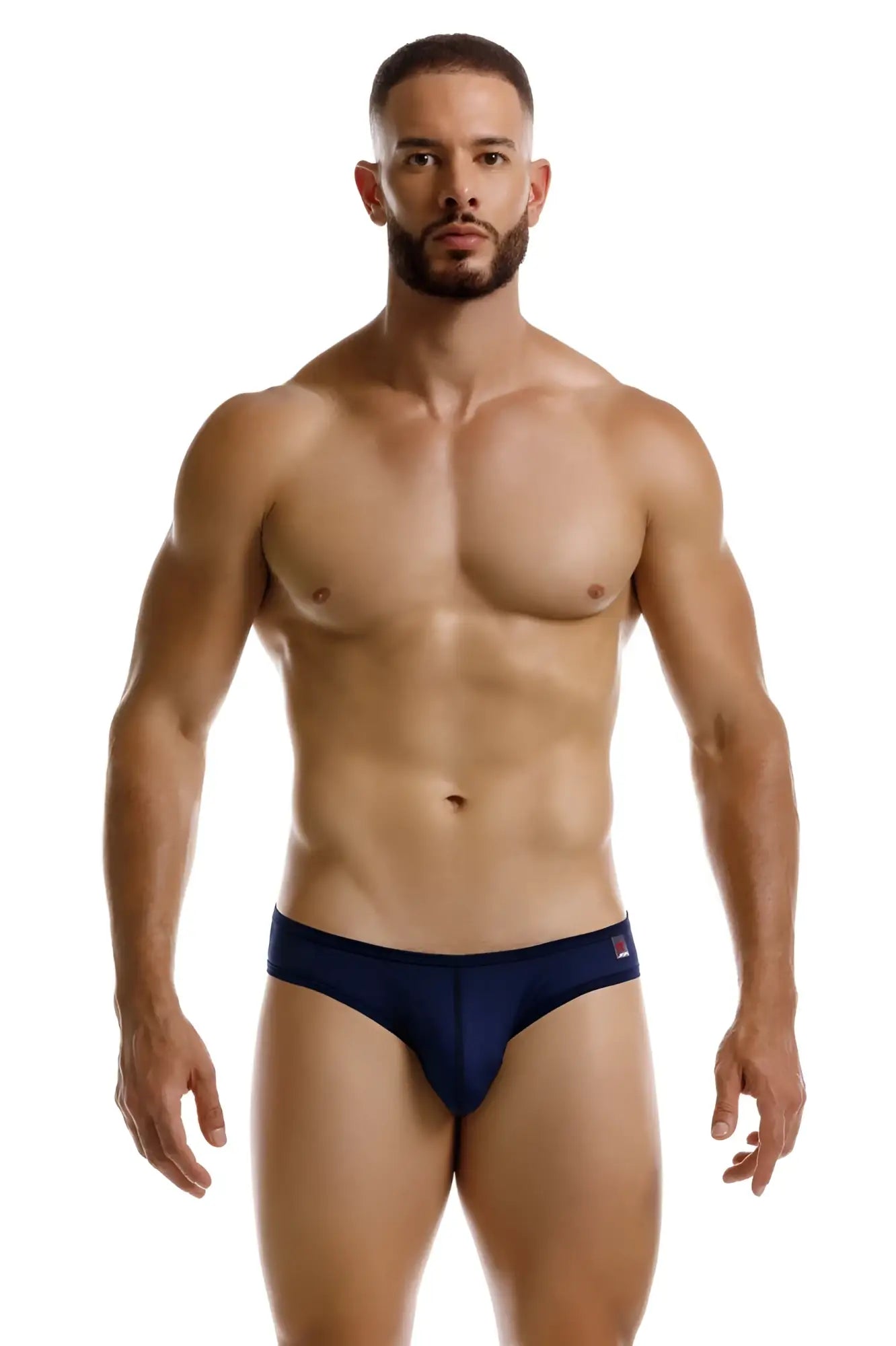 Navy blue jor 2242 origin thong briefs with a small red and white logo on the waistband front view