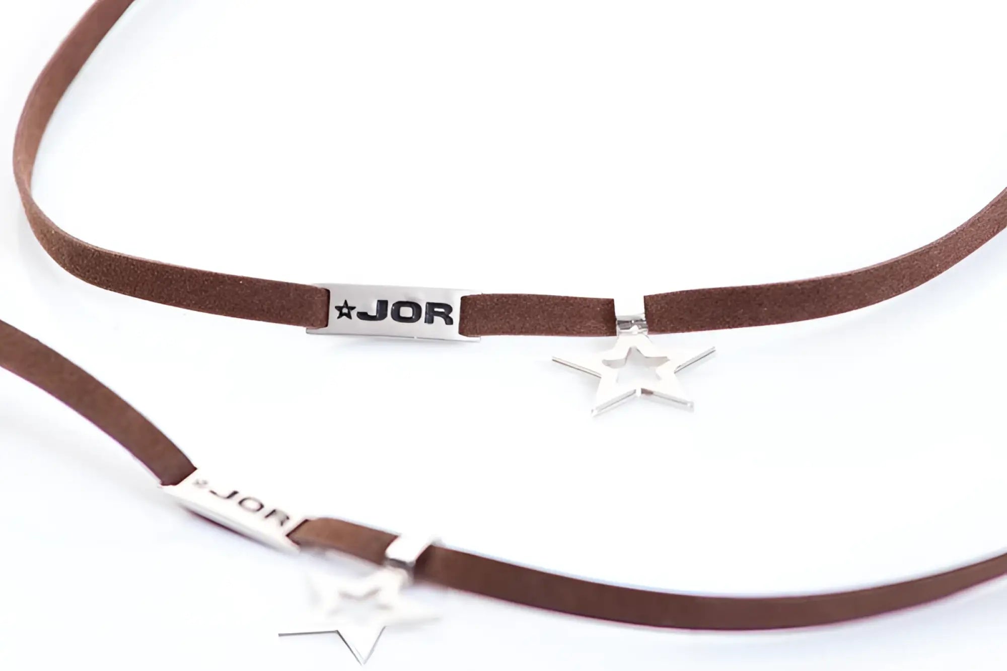 Brown suede choker necklace with silver star charms and rectangular jor branded tag size one size