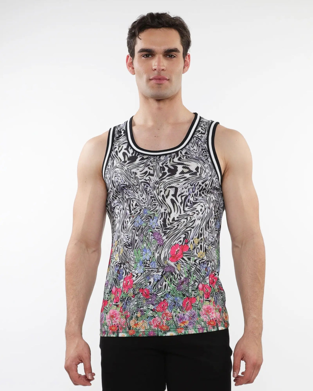 Black and white jungle printed mesh tank with stripe ribbing and vibrant pink purple green floral accents at the hem