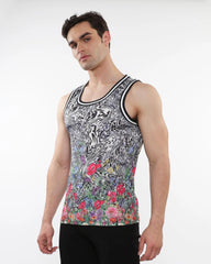 A men’s sleeveless jungle printed mesh tank with stripe ribbing featuring a black white swirl and vibrant floral design