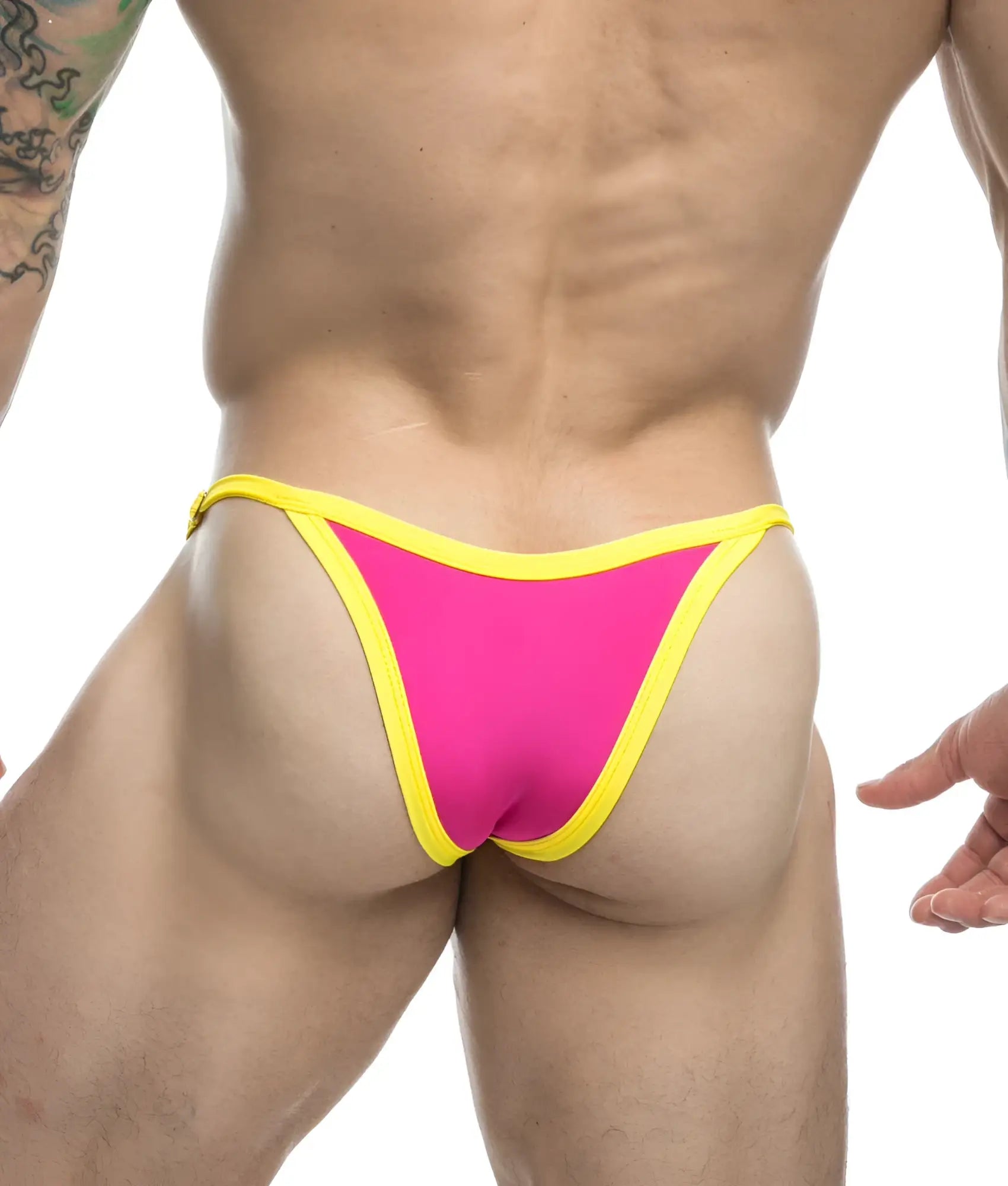 Vibrant pink and yellow thong from justin + simon bikini one featuring a snug form-fitting design shown from the back