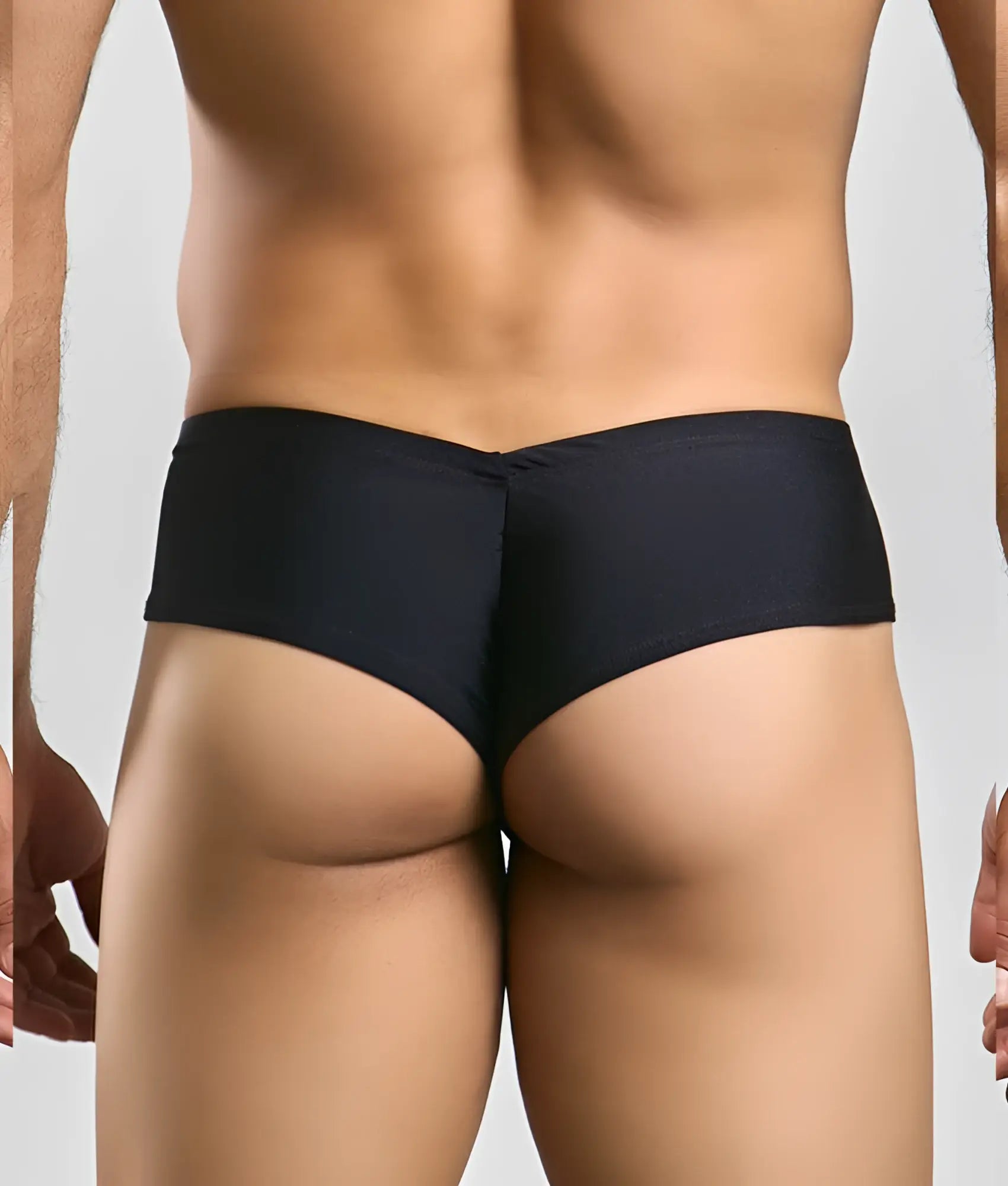 Black justin + simon cheek briefs with subtle textured fabric and centered back seam shown from the back side