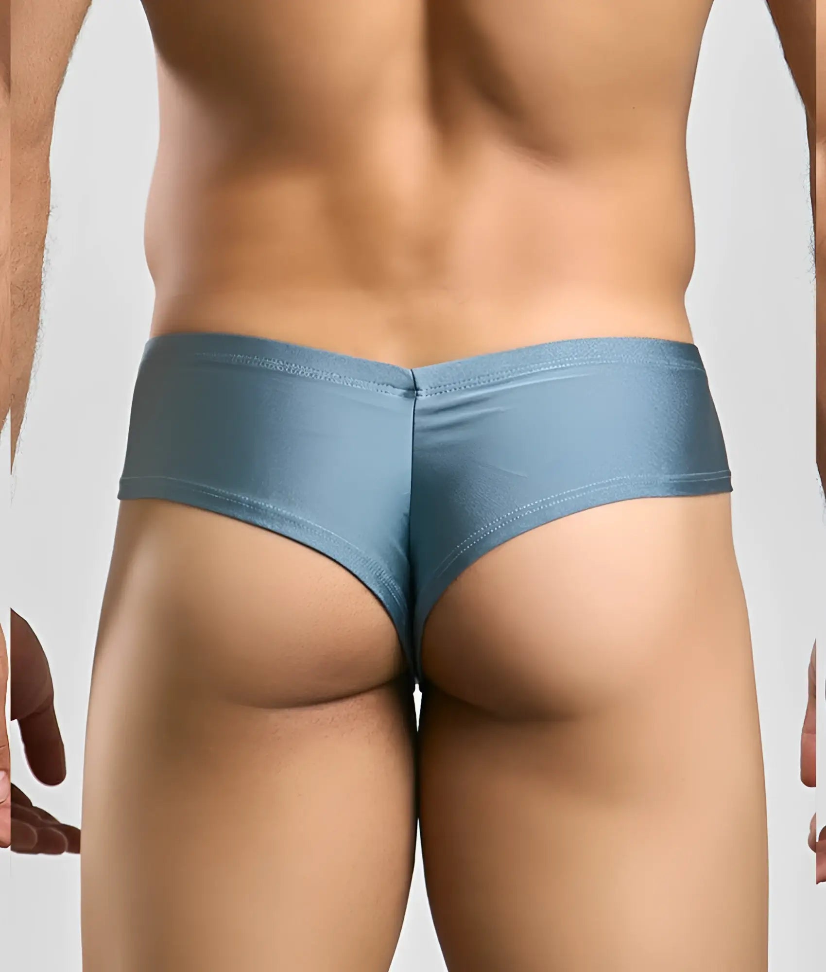 Blue metallic briefs with a sleek form fitting design from justin + simon cheek visible from the back side