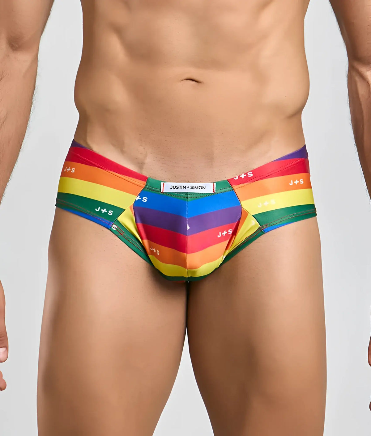 Rainbow-striped men’s briefs with j+s branding and central pocket made from stretchy fabric by Justin plus Simon