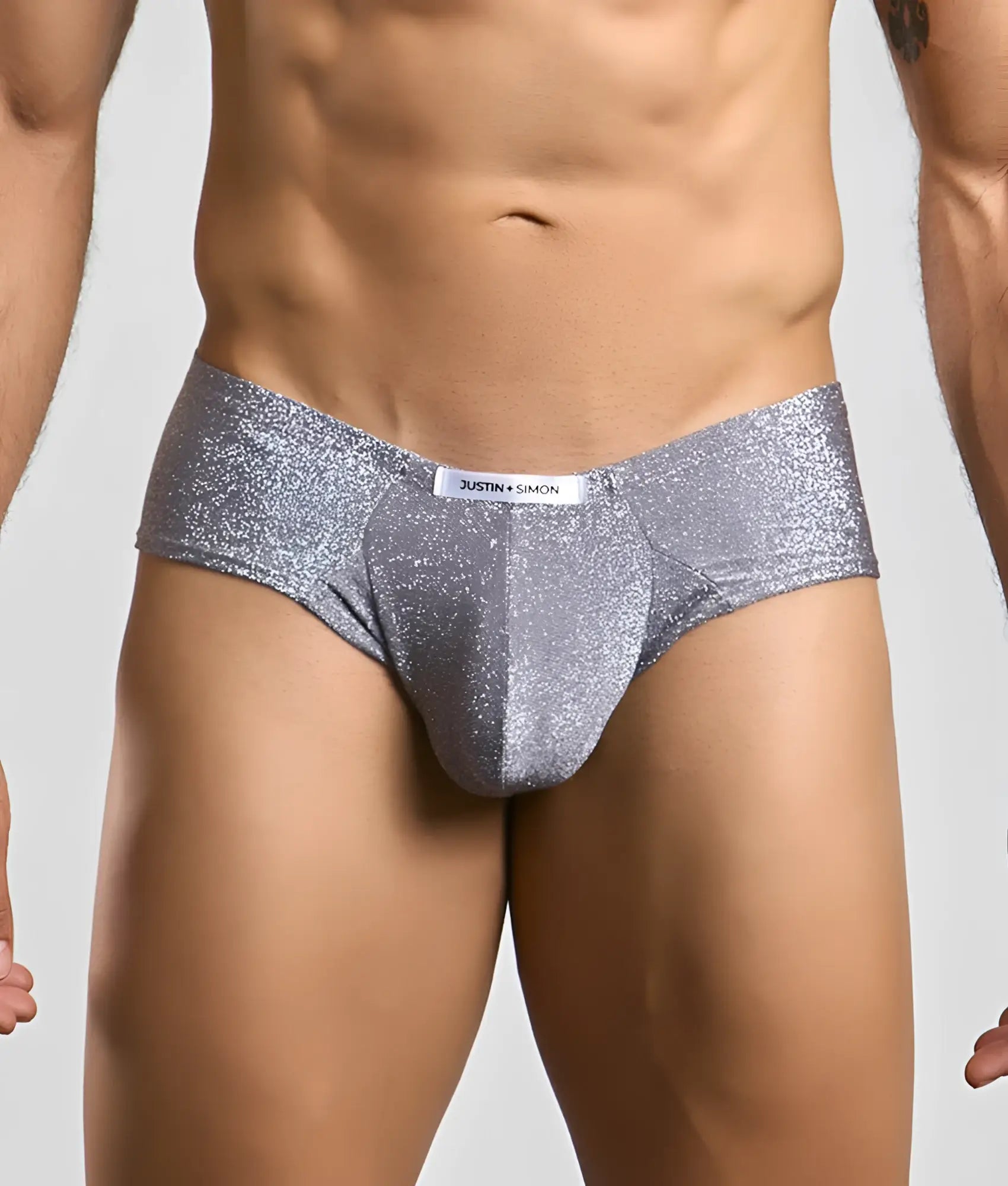 Silver glitter briefs with a sleek form-fitting design and branded waistband from justin + simon cheek