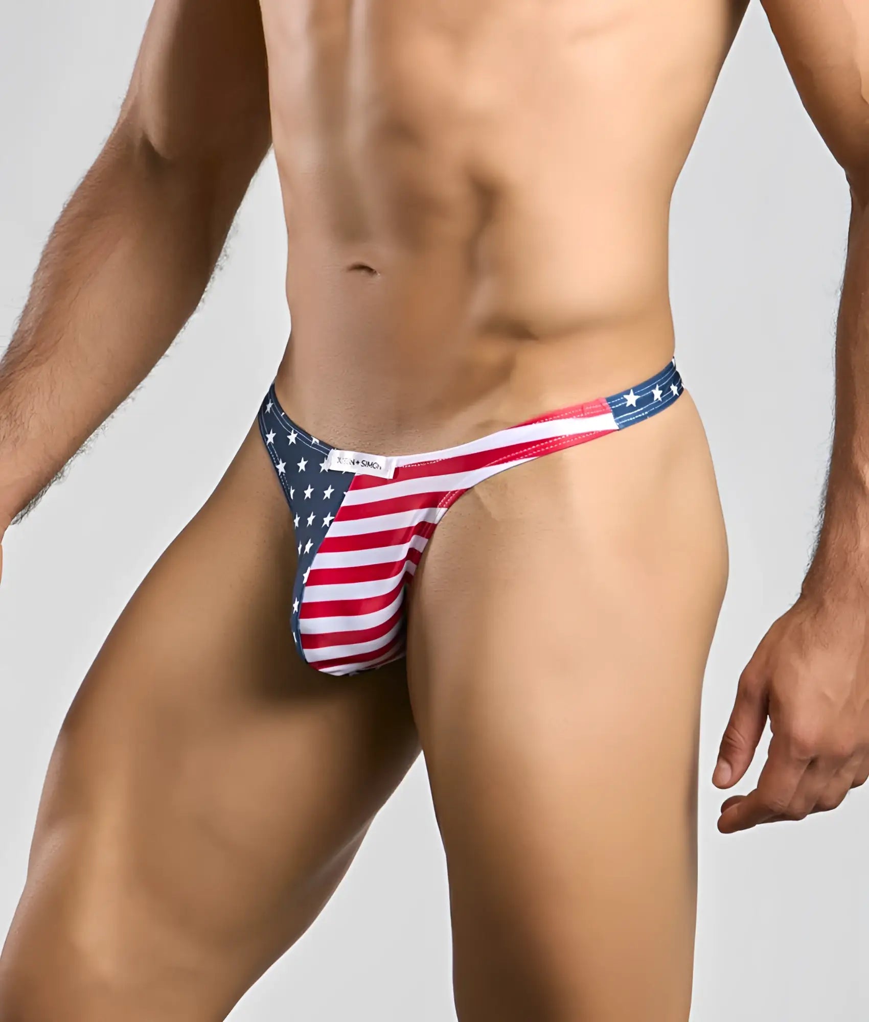 Justin + Simon classic tanga thong in red white and blue stretchy fabric with American flag design shown from the back