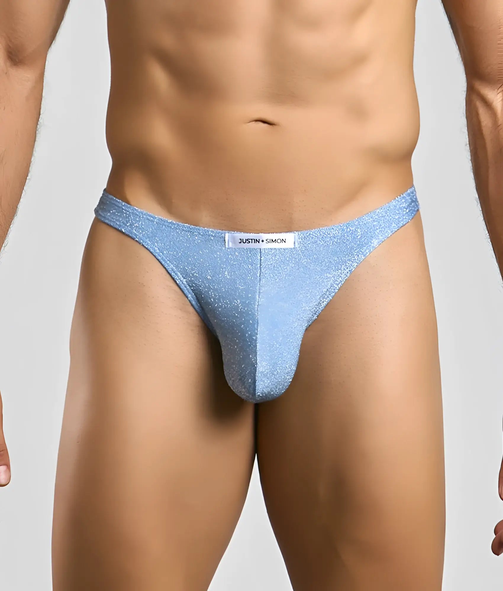 Light blue glittery thong by Justin Simon made of sparkly fabric in the Justin plus Simon Classic Tanga collection