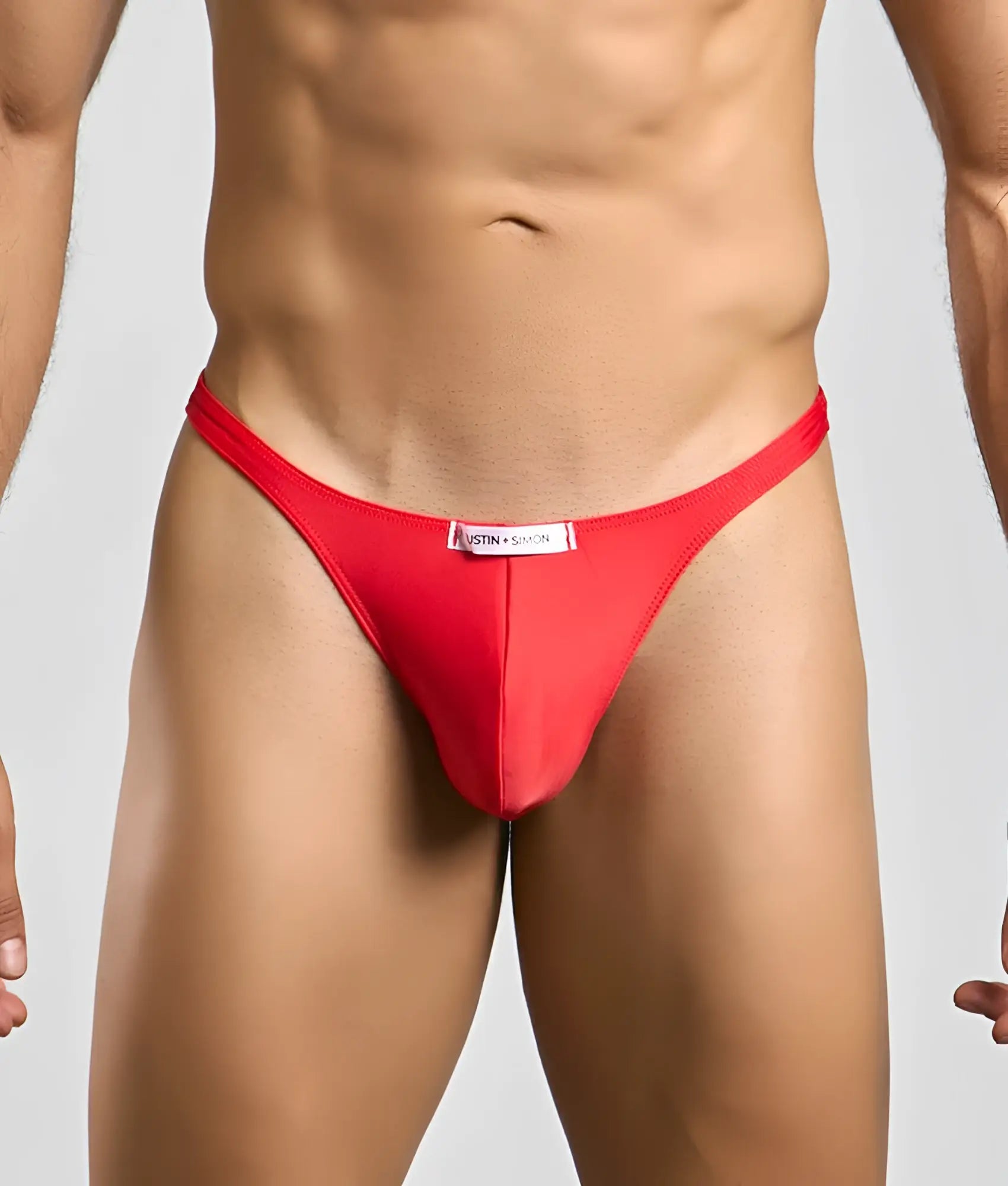 Red thong classic tanga by justin + simon featuring a white label at the waistband on the back side