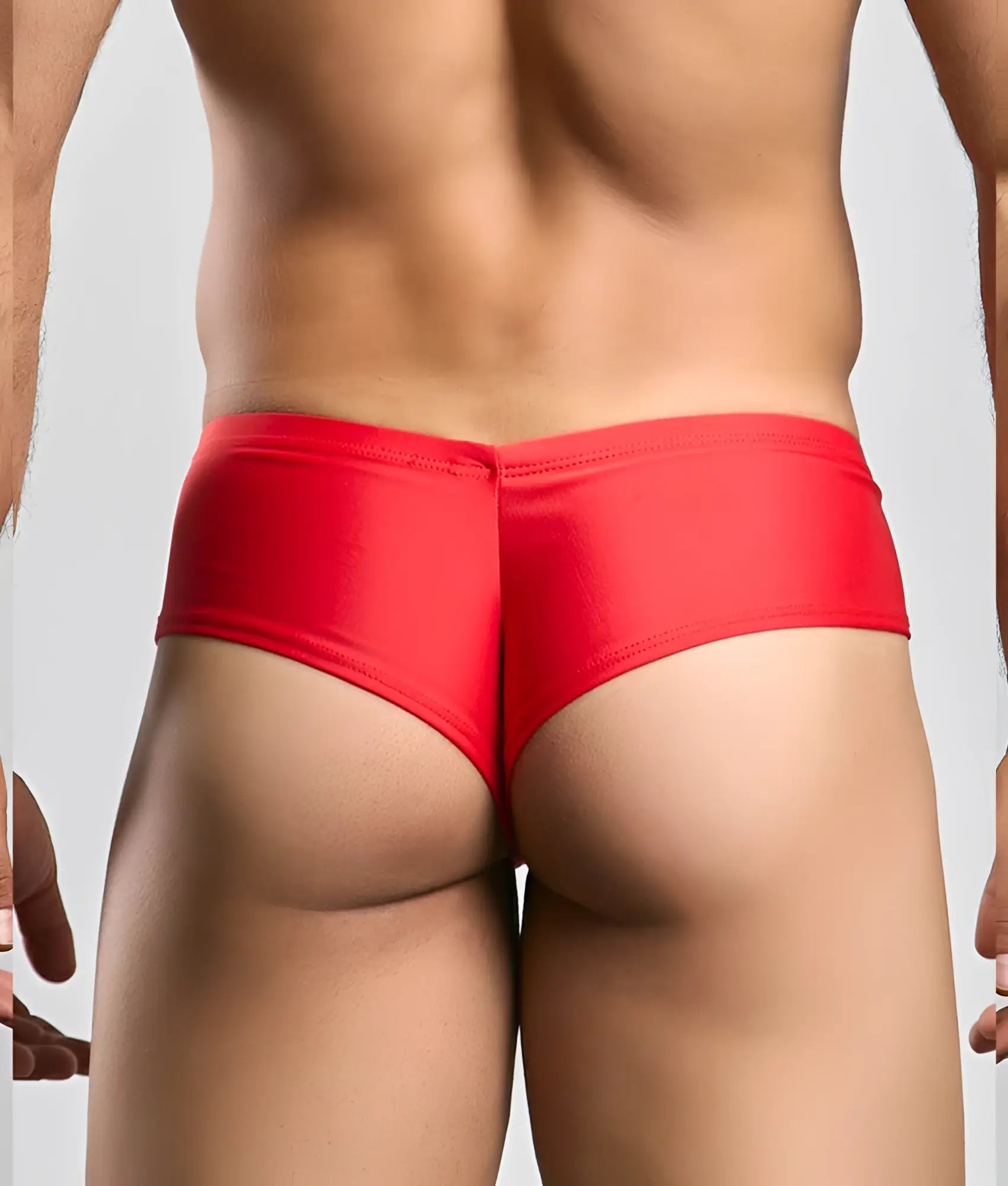 Justin + Simon cheek red shiny fabric briefs showing the back side with a smooth glossy finish