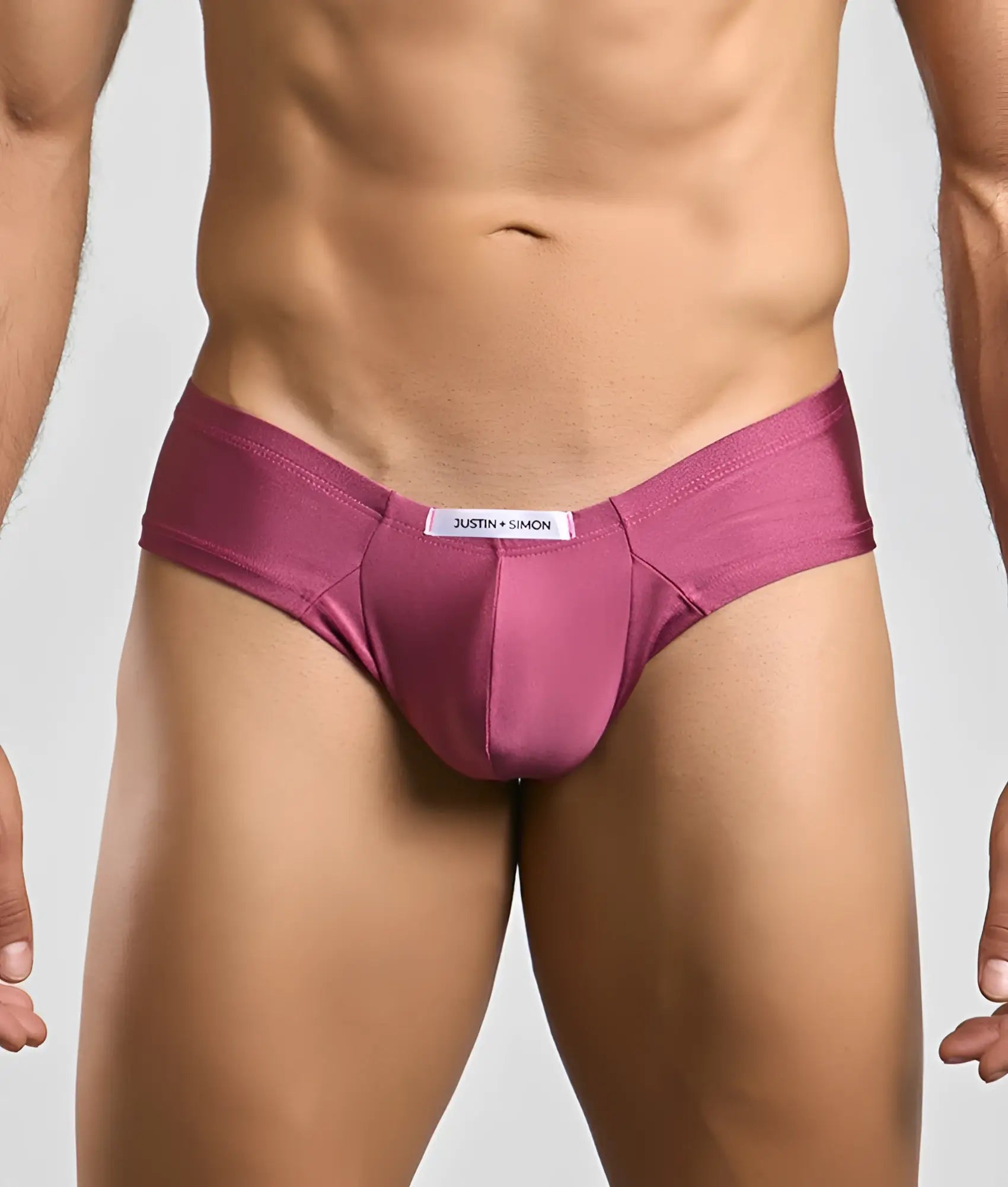 A sleek satin-like magenta brief from Justin Simon in the Justin plus Simon Cheek collection